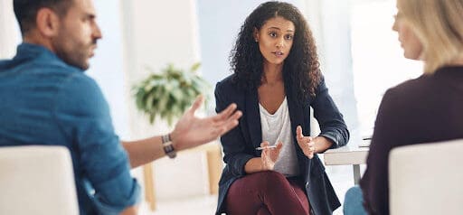 man and woman participate in mediation to help with communication Helland & Hurwitz Attorneys at Law Colorado