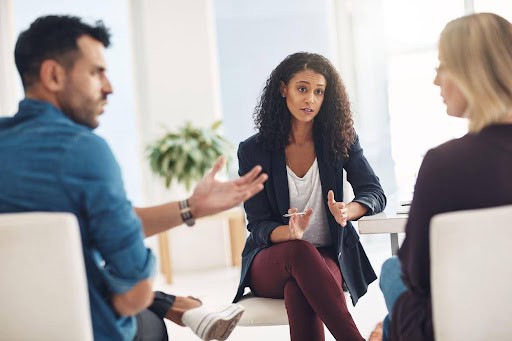 man and woman participate in mediation to help with communication Helland & Hurwitz Attorneys at Law Colorado
