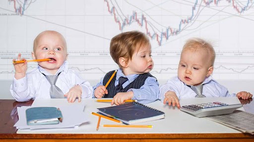 three toddlers pretending to prepare taxes Helland & Hurwitz Attorneys at Law Colorado