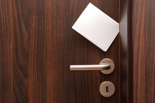 white note in door jam Helland & Hurwitz Attorneys at Law Colorado
