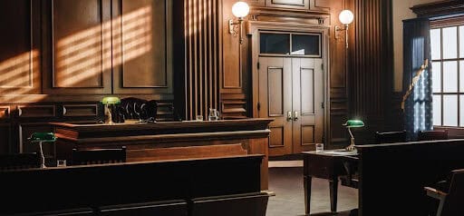 empty appeals courtroom with wood walls and furniture Helland & Hurwitz Attorneys at Law Colorado