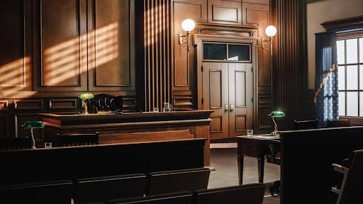 empty appeals courtroom with wood walls and furniture Helland & Hurwitz Attorneys at Law Colorado