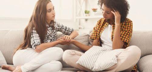 woman confides in friend about getting a divorce Helland & Hurwitz Attorneys at Law Colorado