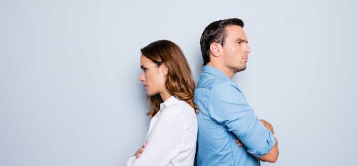 man and woman with backs to each other and are both angry Helland & Hurwitz Attorneys at Law Colorado