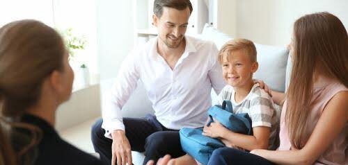 divorced couple share custody with son as they discuss their plan with a therapist Helland & Hurwitz Attorneys at Law Colorado