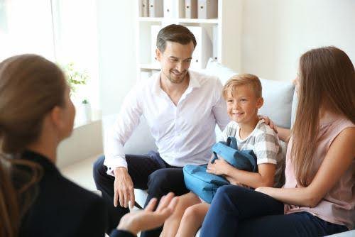 divorced couple share custody with son as they discuss their plan with a therapist Helland & Hurwitz Attorneys at Law Colorado