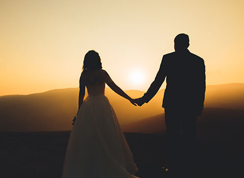 hero close up image of man and woman married at sunset Helland & Hurwitz Attorneys at Law Colorado