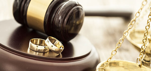 gavel, two wedding rings, and legal scale Helland & Hurwitz Attorneys at Law Colorado