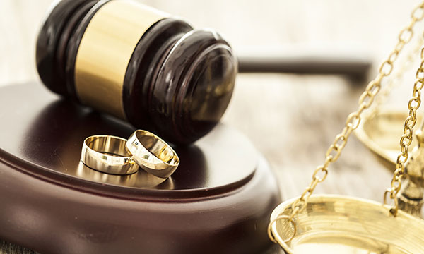 gavel, two wedding rings, and legal scale Helland & Hurwitz Attorneys at Law Colorado