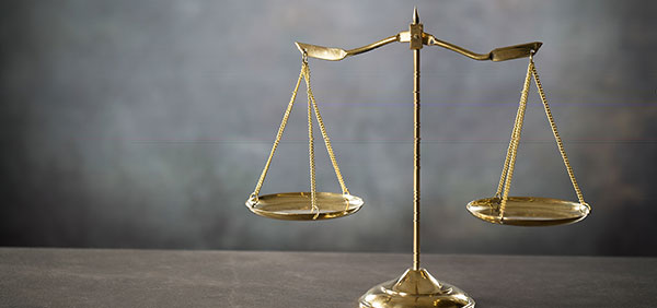 picture of gold balanced legal scale Helland & Hurwitz Attorneys at Law Colorado