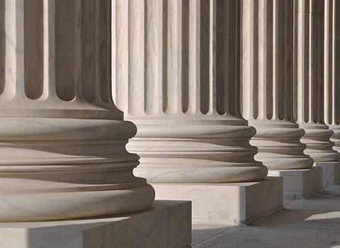 close up photo of courthouse columns Helland & Hurwitz Attorneys at Law Colorado