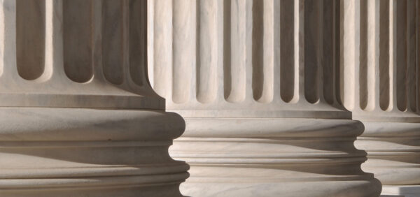 close up of courthouse columns in front of building Helland & Hurwitz Attorneys at Law Colorado