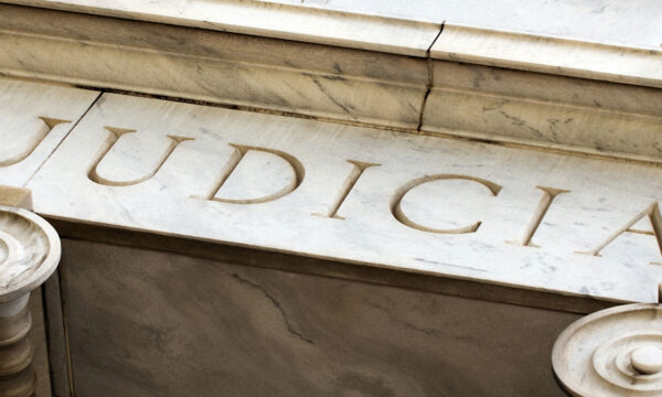 close up of "judicial" on courthouse Helland & Hurwitz Attorneys at Law Colorado